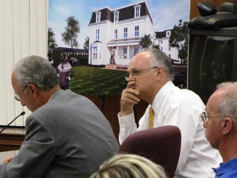 Developer Roger Mumford with an architect’s rendering of the T. Thomas Fortune house as it would appear after restoration. (Credit: John T. Ward/redbankgreen.com)